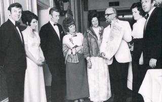 Southam Lions Club Members examining The International Charter. Left to Right: Lion Ken Graham & Mrs Jacky Graham, President Tony Hindley & Mrs Hindley, Mrs Hughes & District Governor Lion Peter Hughes, Mrs Swaby & Vice President Peter Swaby.